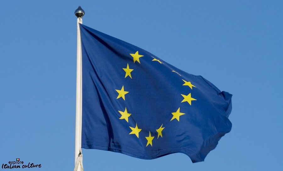 12 gold stars on a blue background: The flag of the European Union.
