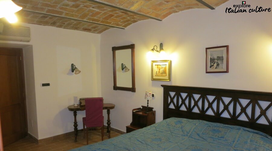 Air conditioning makes the Hotel Gea bearable in the heat of the summer. A bedroom at the Hotel Gea di Vulcano, Rome, including arched ceiling, desk and air conditioning.