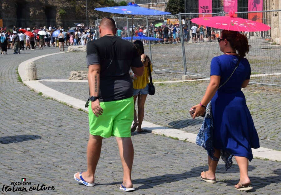 Parasols keep this couple shaded from the worst of the suns rays in Rome. Parasols keep this couple shaded from the heat of Rome in summer.