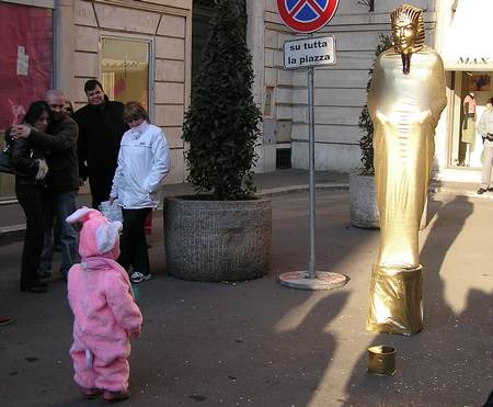 Baby bunny kid with a statue
