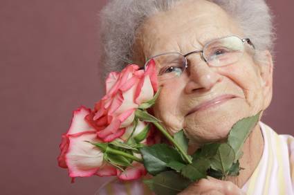 Italian Mother's Day recipes An Italian Mother holding a small bunch of red flowers