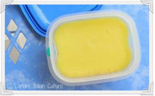 A plastic container of olive oil spread