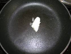 A knob of butter in a frying pan