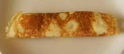 A Finished pancake wrapped into a roll