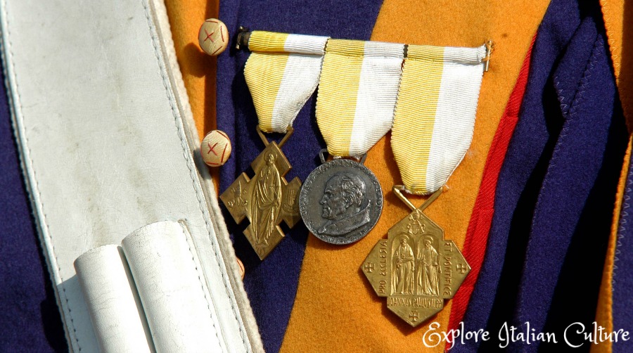 Three medals being worn by a Swiss Guard.