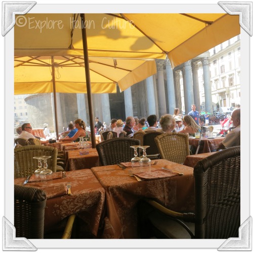 Enjoy a drink or a meal at one of the many restaurants outside the Pantheon One of the many restaurants outside the Pantheon, with yellow umbrellas