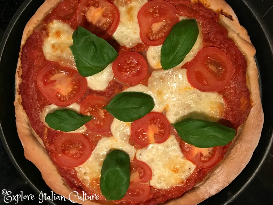 Add the basil to Pizza Margherita.